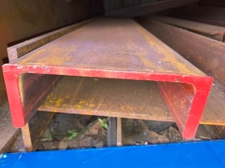 Red end-cap RHS beam close-up at Marshall Steel