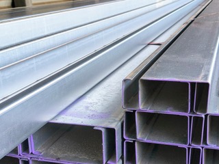 Galvanised C-purlins stacked at Marshall Steel — common patio-frame material