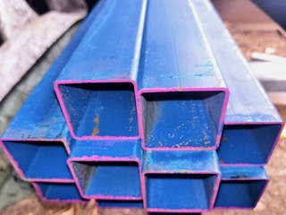 Blue-painted SHS stock at Marshall Steel — painted finish steel