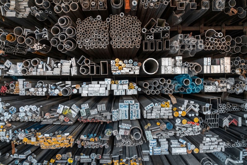 Steel off-cuts, drops and short lengths sorted by size at the Marshall Steel yard — pipe, tube, bar and angle